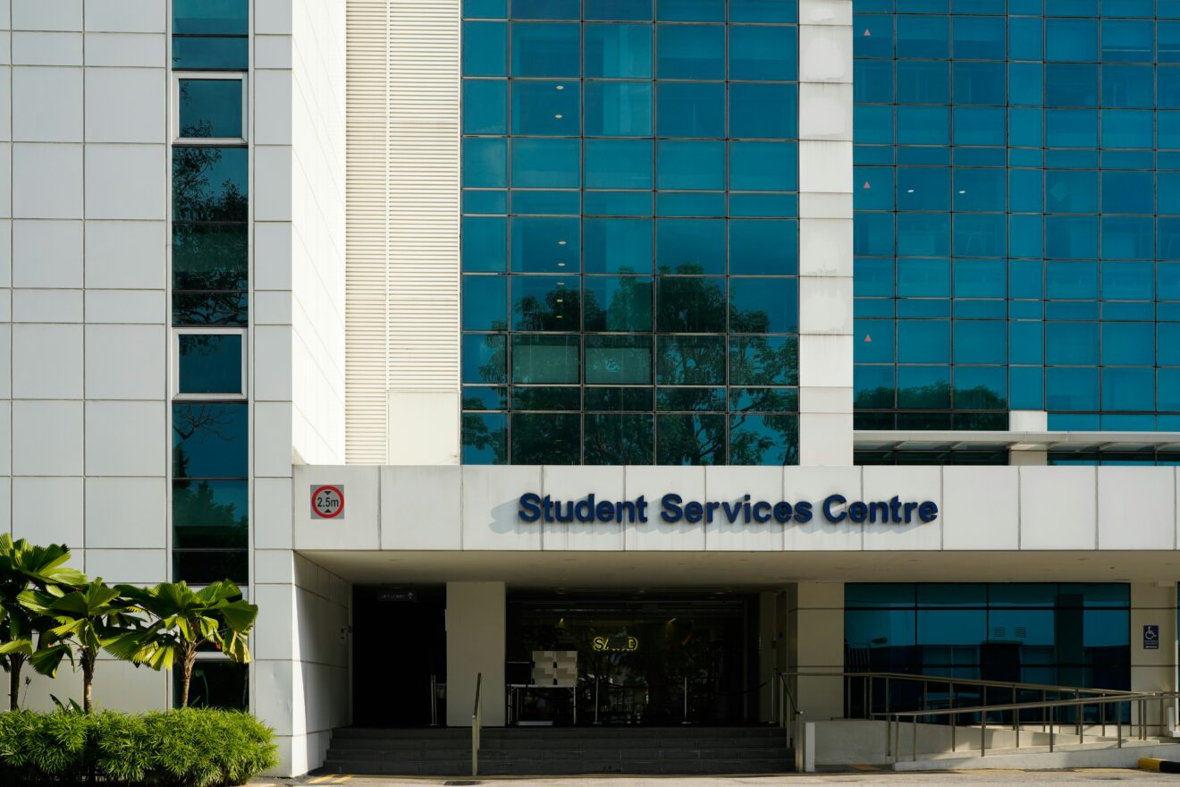 Tall white building with a text "Student Services Center"